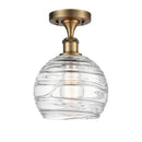 Deco Swirl Semi-Flush Mount shown in the Brushed Brass finish with a Clear shade