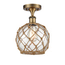 Farmhouse Rope Semi-Flush Mount shown in the Brushed Brass finish with a Clear Glass with Brown Rope shade