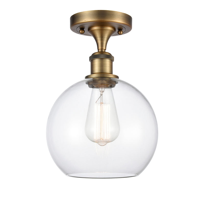 Athens Semi-Flush Mount shown in the Brushed Brass finish with a Clear shade