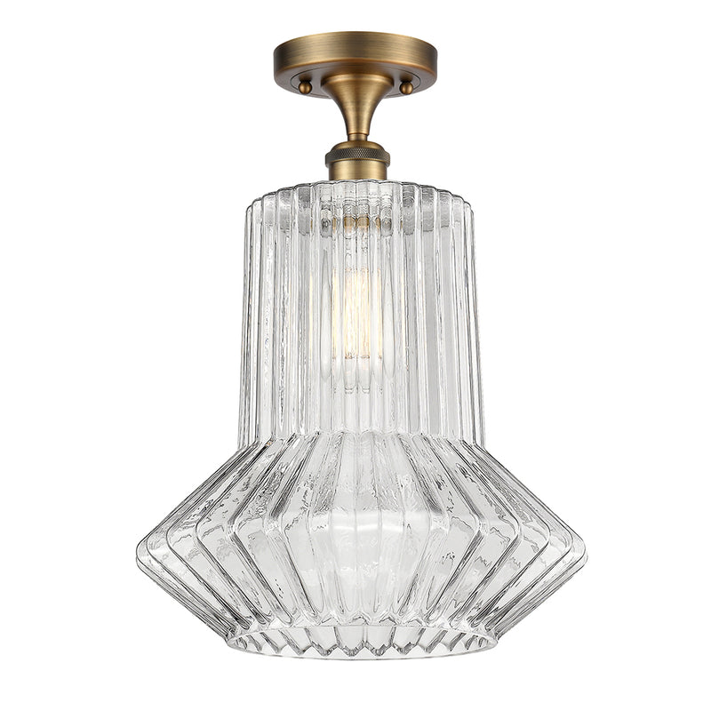 Springwater Semi-Flush Mount shown in the Brushed Brass finish with a Clear Spiral Fluted shade