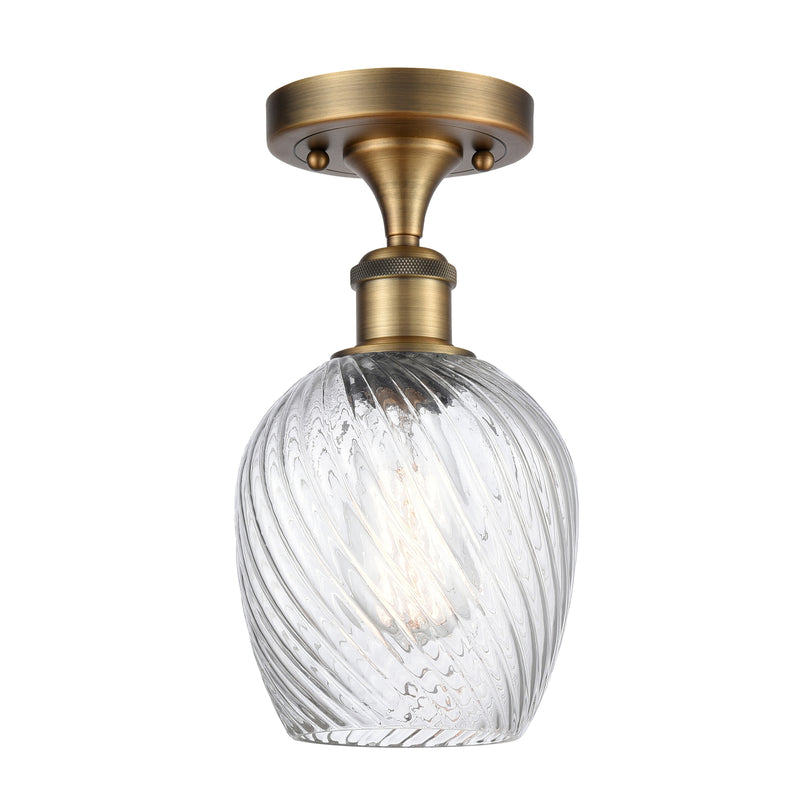 Salina Semi-Flush Mount shown in the Brushed Brass finish with a Clear Spiral Fluted shade