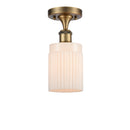Hadley Semi-Flush Mount shown in the Brushed Brass finish with a Matte White shade