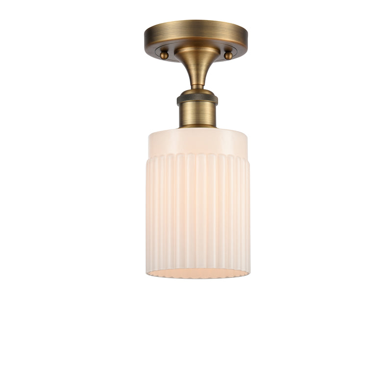 Hadley Semi-Flush Mount shown in the Brushed Brass finish with a Matte White shade