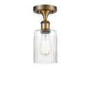 Hadley Semi-Flush Mount shown in the Brushed Brass finish with a Clear shade