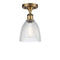 Castile Semi-Flush Mount shown in the Brushed Brass finish with a Clear shade