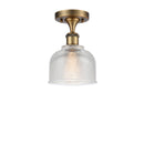 Dayton Semi-Flush Mount shown in the Brushed Brass finish with a Clear shade