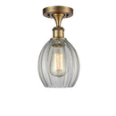 Eaton Semi-Flush Mount shown in the Brushed Brass finish with a Clear shade