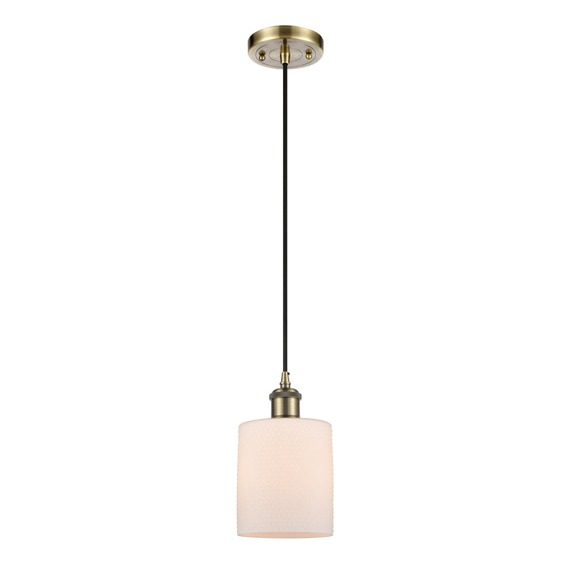 Cobbleskill Mini Pendant shown in the Antique Brass finish with a Matte White shade