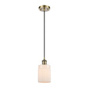 Hadley Mini Pendant shown in the Antique Brass finish with a Matte White shade