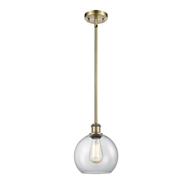 Athens Mini Pendant shown in the Antique Brass finish with a Clear shade