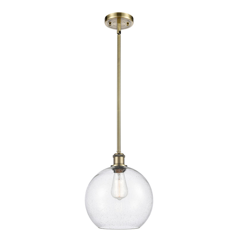 Athens Mini Pendant shown in the Antique Brass finish with a Seedy shade