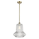 Springwater Mini Pendant shown in the Antique Brass finish with a Clear Spiral Fluted shade