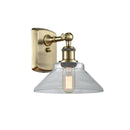 Orwell Sconce shown in the Antique Brass finish with a Clear shade