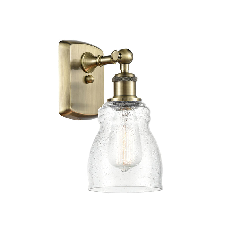 Ellery Sconce shown in the Antique Brass finish with a Seedy shade