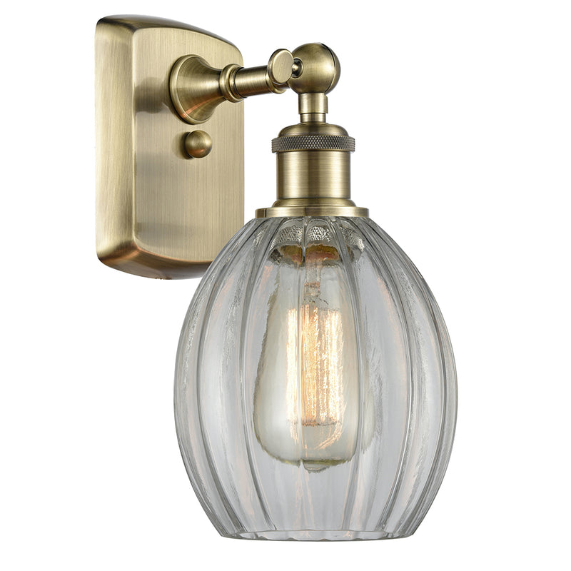 Eaton Sconce shown in the Antique Brass finish with a Clear shade