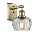 Fenton Sconce shown in the Antique Brass finish with a Clear shade