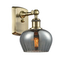 Fenton Sconce shown in the Antique Brass finish with a Plated Smoke shade