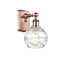 Deco Swirl Sconce shown in the Antique Copper finish with a Clear shade