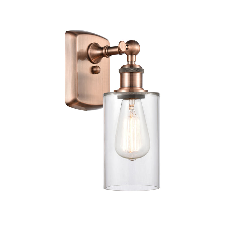 Clymer Sconce shown in the Antique Copper finish with a Clear shade