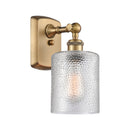 Cobbleskill Sconce shown in the Brushed Brass finish with a Clear shade