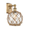 Farmhouse Rope Sconce shown in the Brushed Brass finish with a Clear Glass with Brown Rope shade