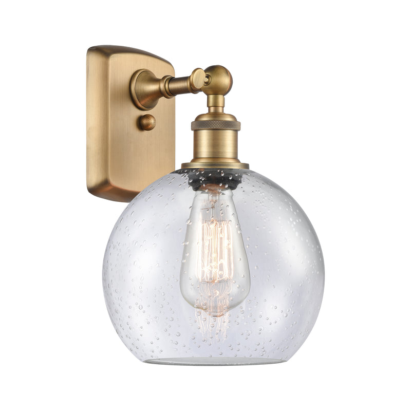 Athens Sconce shown in the Brushed Brass finish with a Seedy shade