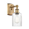 Hadley Sconce shown in the Brushed Brass finish with a Clear shade