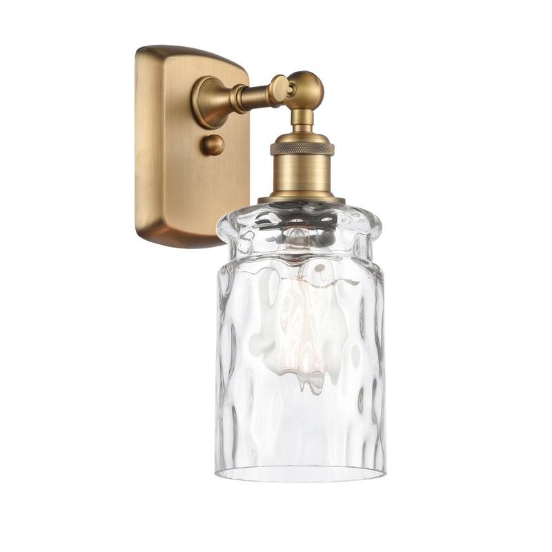 Candor Sconce shown in the Brushed Brass finish with a Clear Waterglass shade