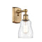 Ellery Sconce shown in the Brushed Brass finish with a Clear shade