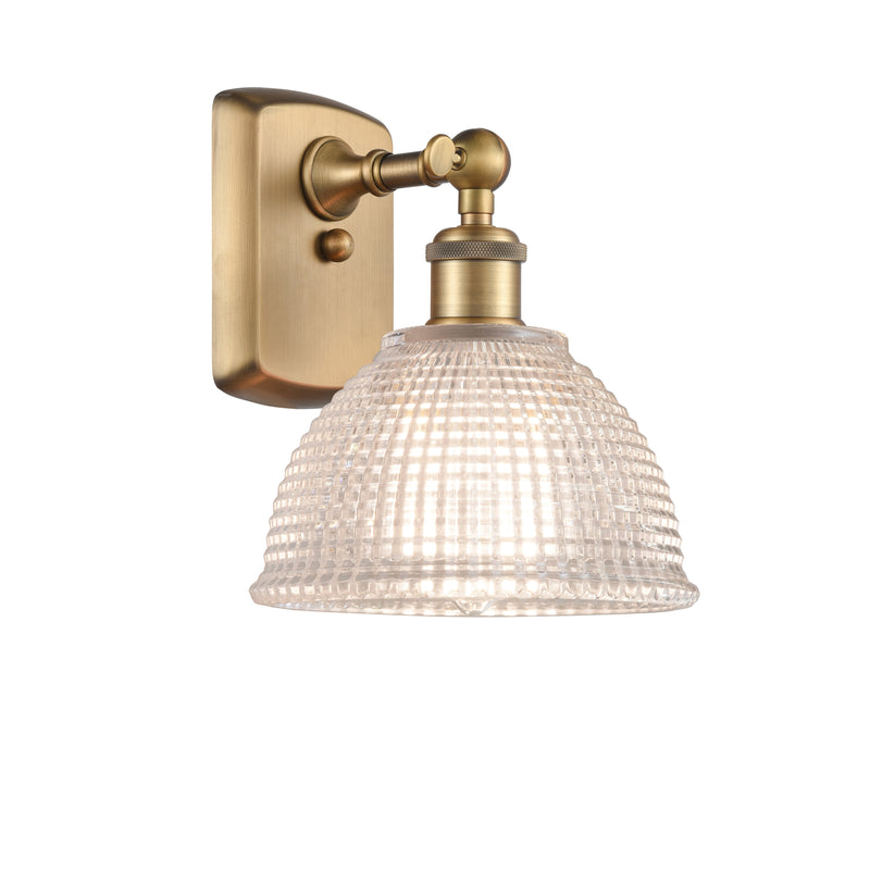 Arietta Sconce shown in the Brushed Brass finish with a Clear shade