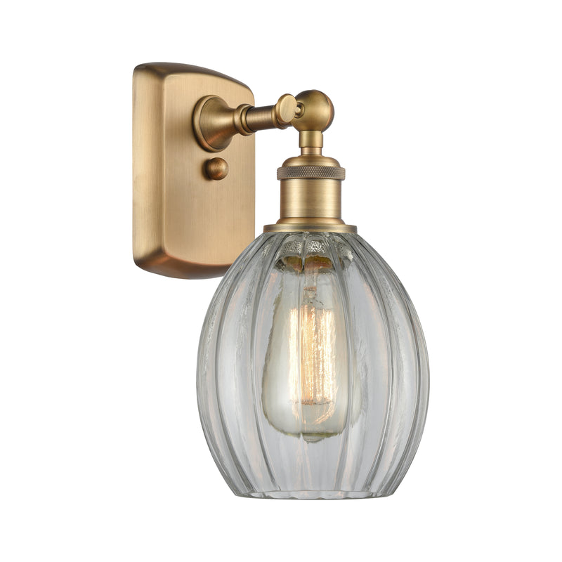 Eaton Sconce shown in the Brushed Brass finish with a Clear shade