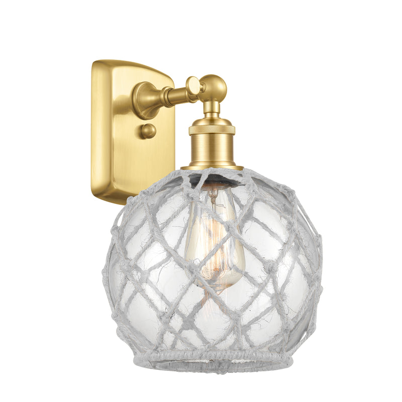 Farmhouse Rope Sconce shown in the Satin Gold finish with a Clear Glass with White Rope shade