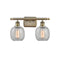 Belfast Bath Vanity Light shown in the Antique Brass finish with a Clear Crackle shade