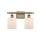 Cobbleskill Bath Vanity Light shown in the Antique Brass finish with a Matte White shade
