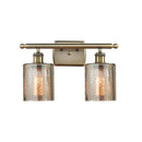 Cobbleskill Bath Vanity Light shown in the Antique Brass finish with a Mercury shade