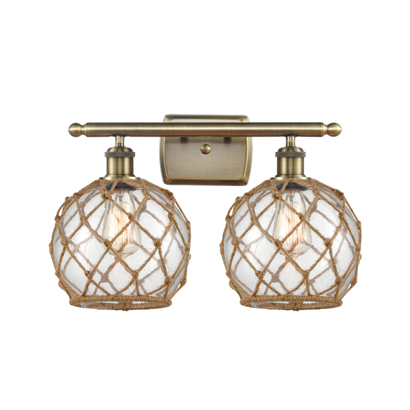 Farmhouse Rope Bath Vanity Light shown in the Antique Brass finish with a Clear Glass with Brown Rope shade