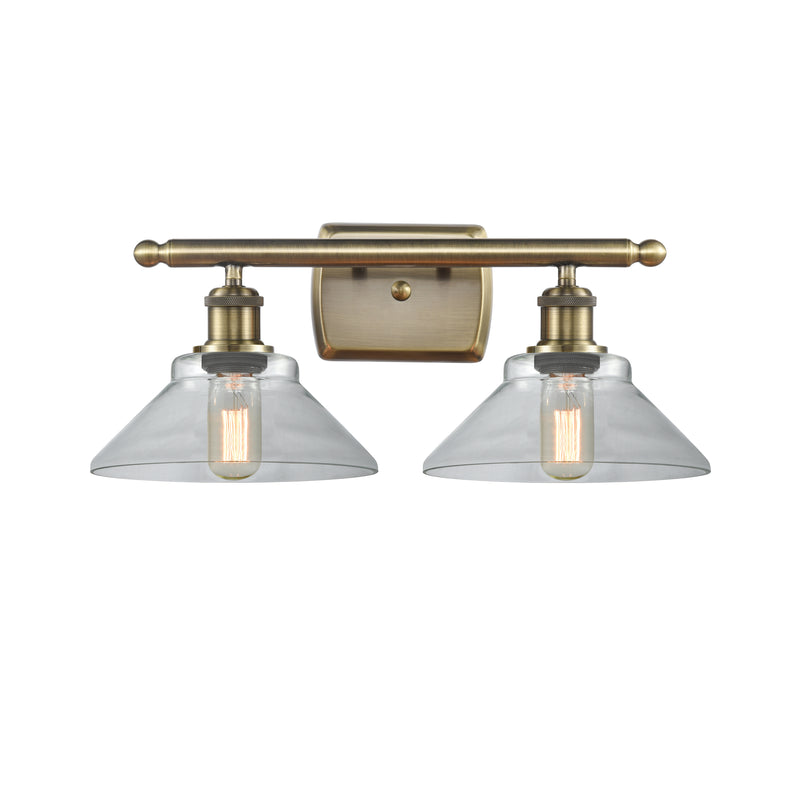 Orwell Bath Vanity Light shown in the Antique Brass finish with a Clear shade