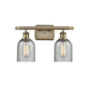 Caledonia Bath Vanity Light shown in the Antique Brass finish with a Charcoal shade