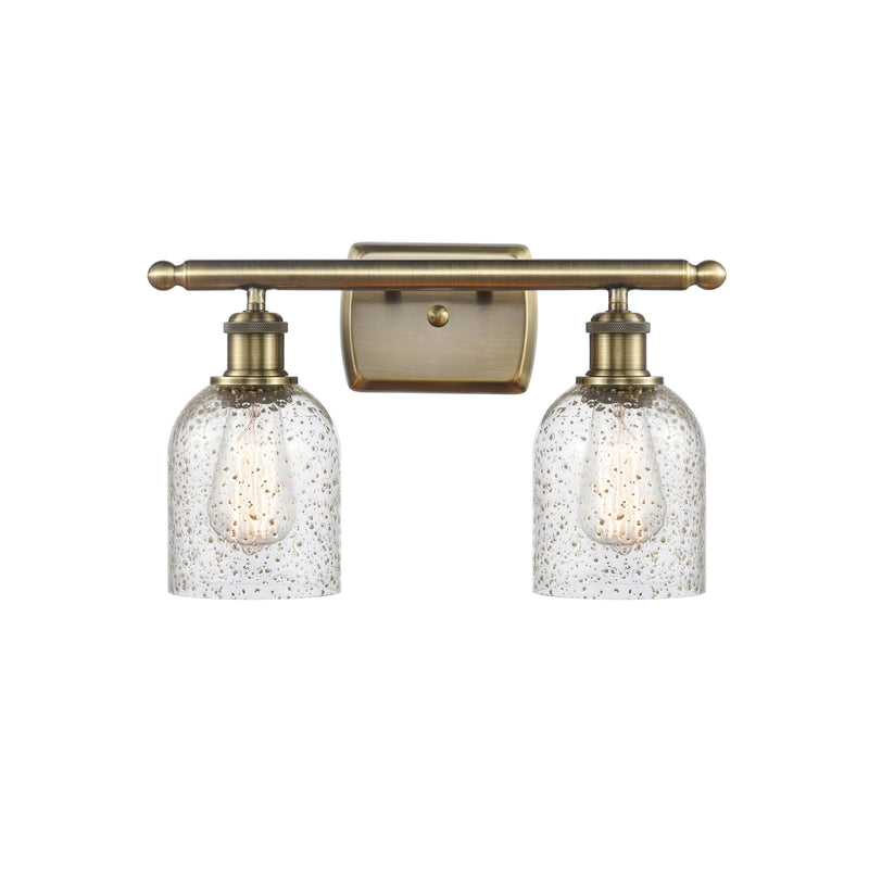 Caledonia Bath Vanity Light shown in the Antique Brass finish with a Mica shade