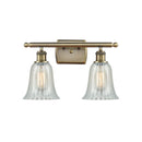 Hanover Bath Vanity Light shown in the Antique Brass finish with a Mouchette shade