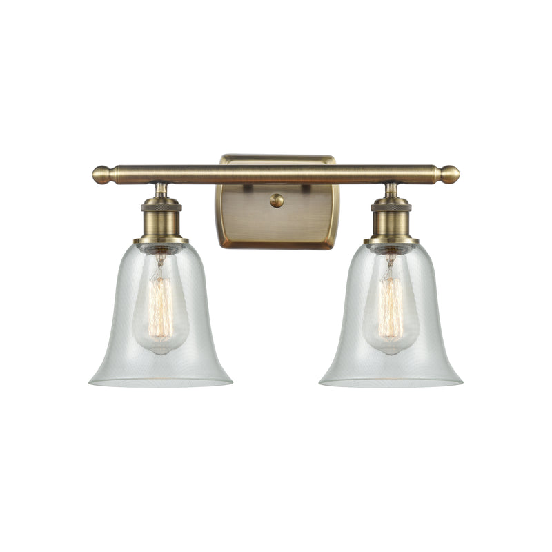 Hanover Bath Vanity Light shown in the Antique Brass finish with a Fishnet shade
