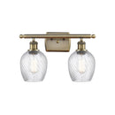 Salina Bath Vanity Light shown in the Antique Brass finish with a Clear Spiral Fluted shade