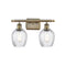 Salina Bath Vanity Light shown in the Antique Brass finish with a Clear Spiral Fluted shade