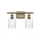 Hadley Bath Vanity Light shown in the Antique Brass finish with a Clear shade