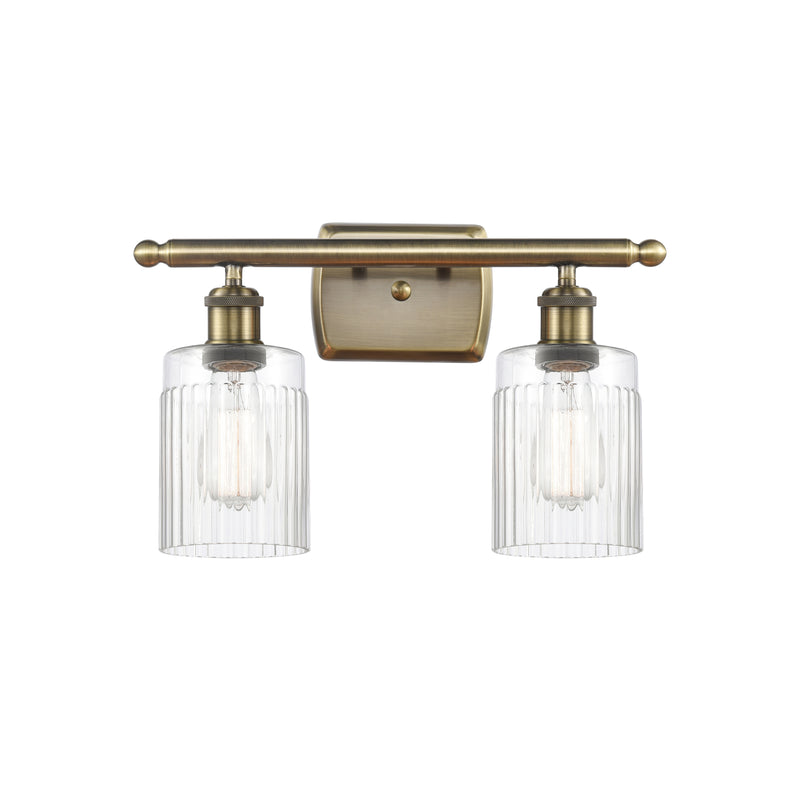 Hadley Bath Vanity Light shown in the Antique Brass finish with a Clear shade
