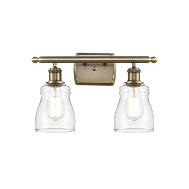 Ellery Bath Vanity Light shown in the Antique Brass finish with a Clear shade