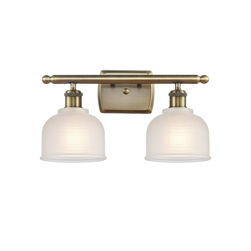 Dayton Bath Vanity Light shown in the Antique Brass finish with a White shade