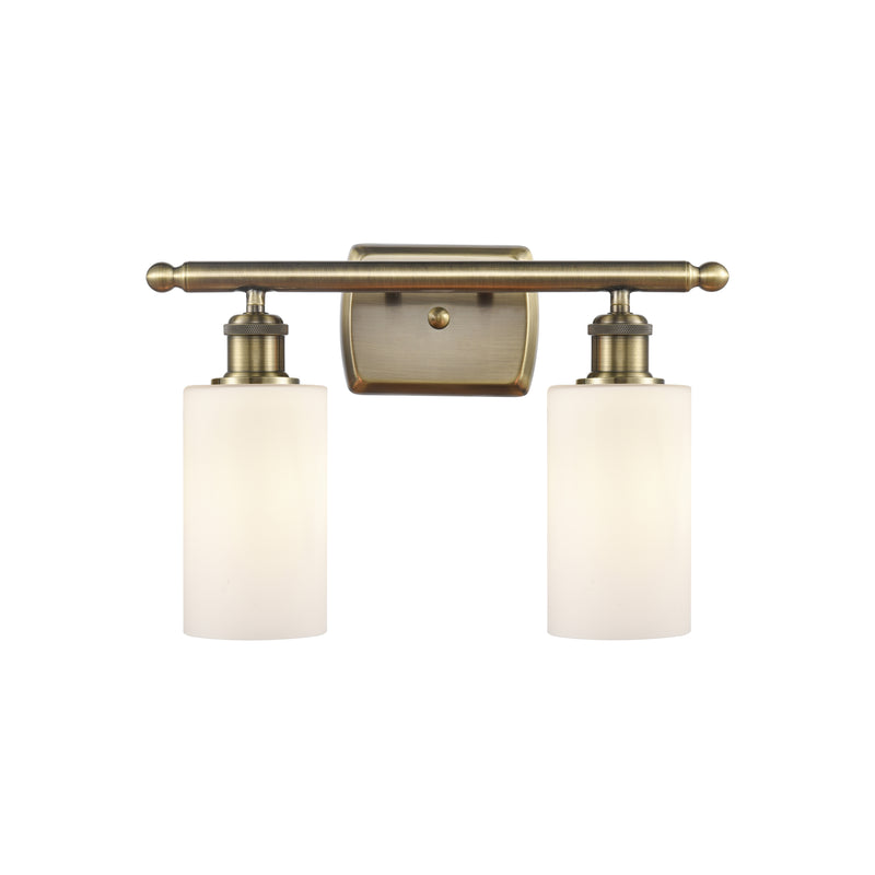 Clymer Bath Vanity Light shown in the Antique Brass finish with a Matte White shade