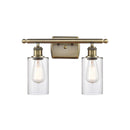 Clymer Bath Vanity Light shown in the Antique Brass finish with a Clear shade