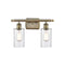 Clymer Bath Vanity Light shown in the Antique Brass finish with a Clear shade